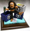 Clay figurine has her bootin' and blue boxing at the same time! Any type of ceramic statue can be created for you.