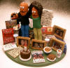 Made to order clay statue incorporates family pictures, pastimes, foibles, food and more!