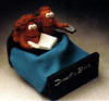 Clay Caricature of Couple in Bed