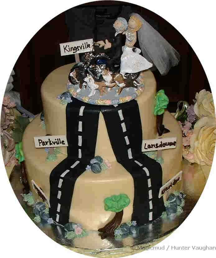 Motorcyclist's Wedding CakeTopper on a made to order cake....Sweeeet!
