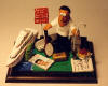 The perfect gift for the Graduate in your life, this one posing with his yacht, tennis raquet, fishing rod, Porsche ,Armani bag, pasta and other important memorabilia around him. A totally unique and original figurine