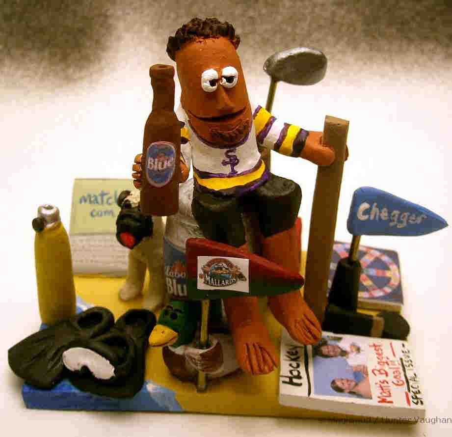 Groom with his scuba gear, pet dog, hockey stick, team flags and more! 